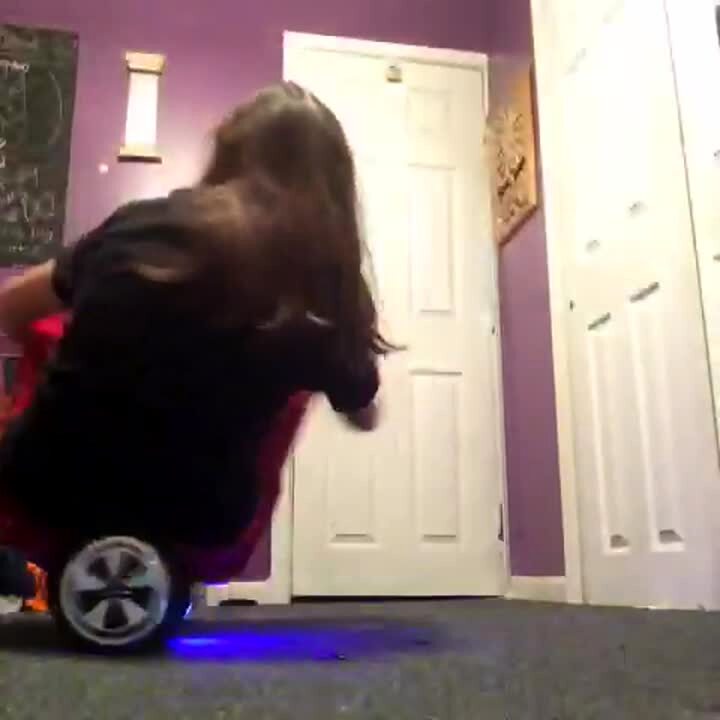 Video thumbnail showing: A teen girl sits on a hoverboard and rides it into her closet door, breaking the door in a house.  Vine/Instagram video.