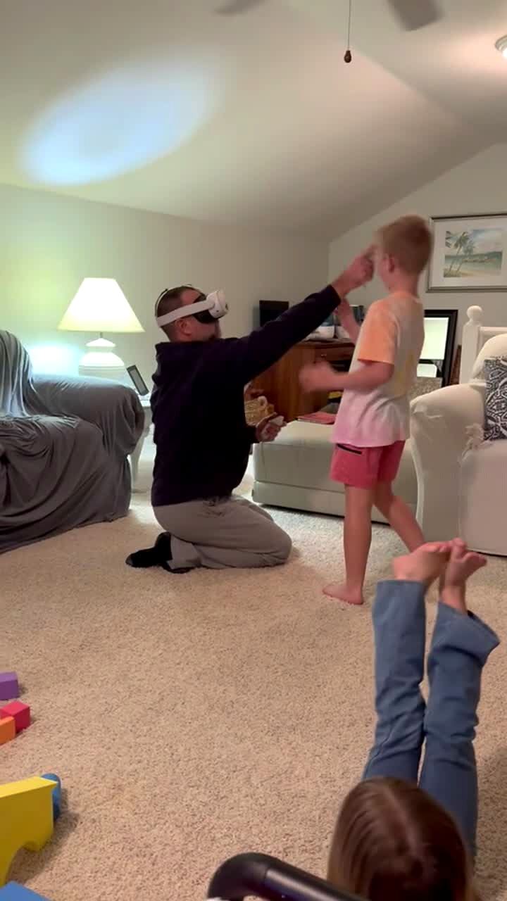Video thumbnail showing: A man accidentally punches a young boy in the face while he has VR game set on in living room.